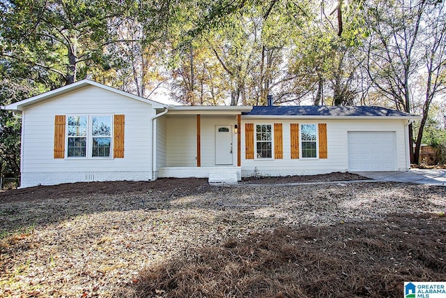 ranch-style house featuring a garage