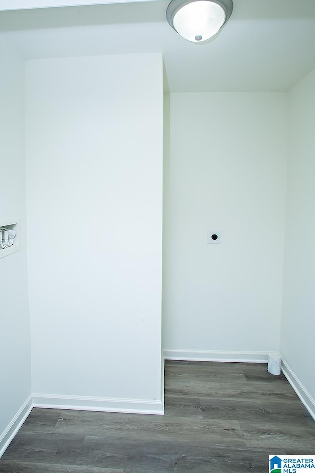 unfurnished room featuring dark wood-type flooring