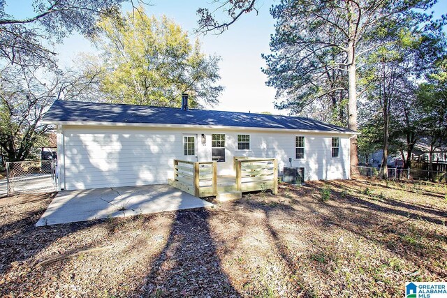 ranch-style home featuring central AC and a patio area