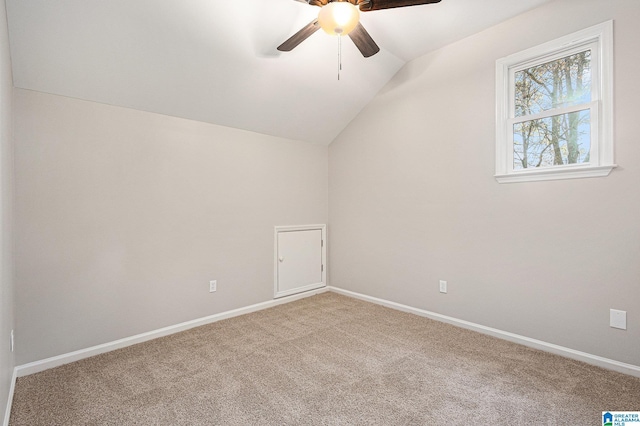 additional living space featuring carpet flooring, ceiling fan, and lofted ceiling