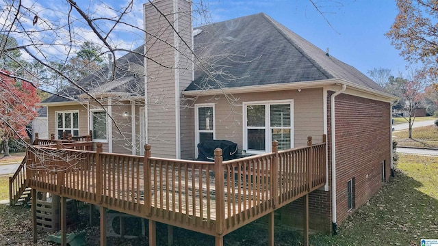 rear view of house with a wooden deck