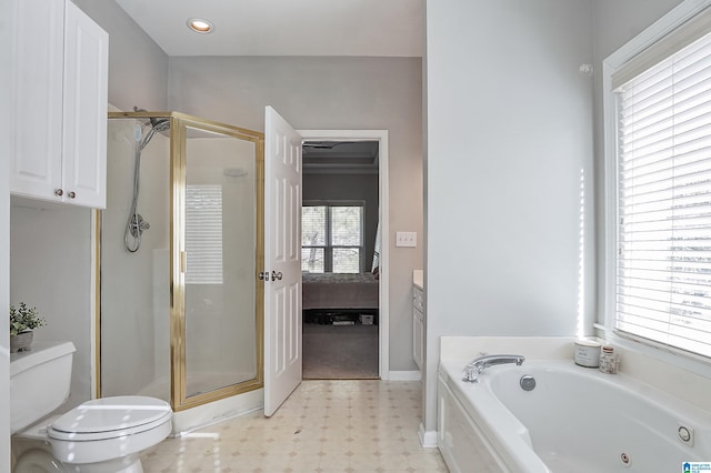 full bathroom featuring vanity, toilet, and independent shower and bath