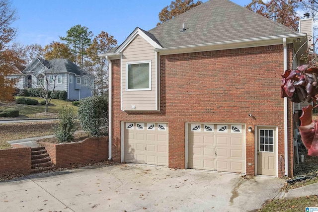 view of side of property featuring a garage