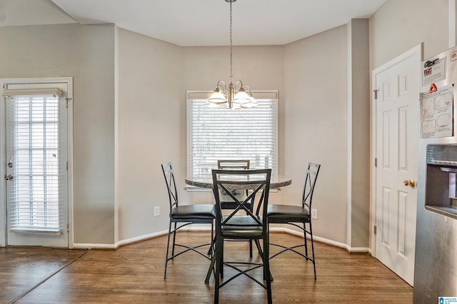 dining area featuring a chandelier and hardwood / wood-style floors