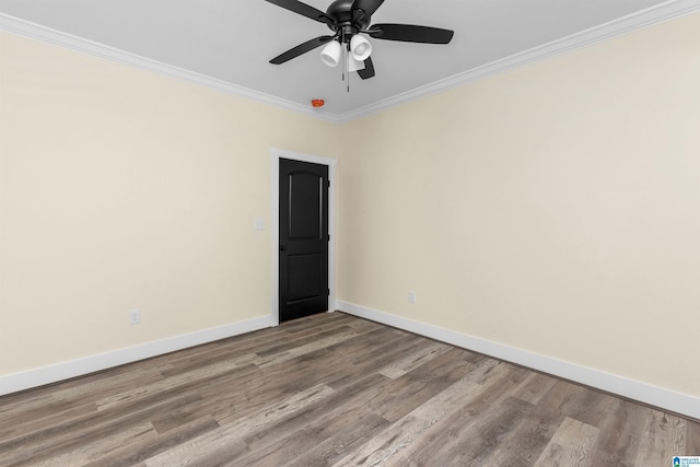 empty room featuring ceiling fan, ornamental molding, and light wood-type flooring