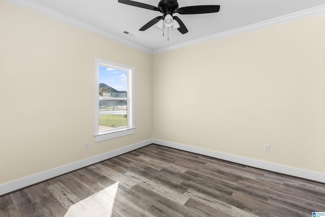 spare room featuring ceiling fan, hardwood / wood-style floors, and ornamental molding