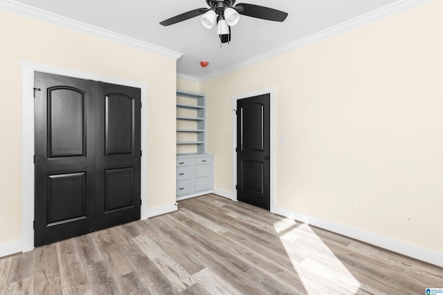 unfurnished bedroom featuring ceiling fan, light hardwood / wood-style floors, ornamental molding, and a closet