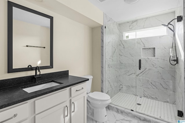 bathroom featuring vanity, toilet, and walk in shower