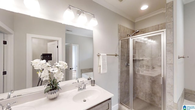 bathroom featuring vanity and a shower with door