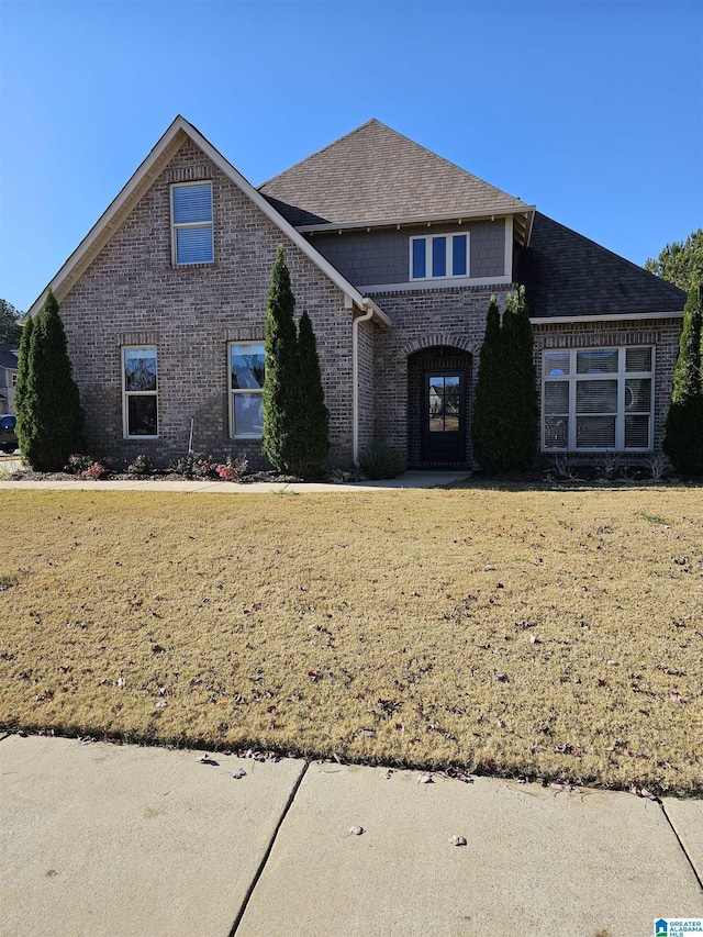 view of property with a front lawn