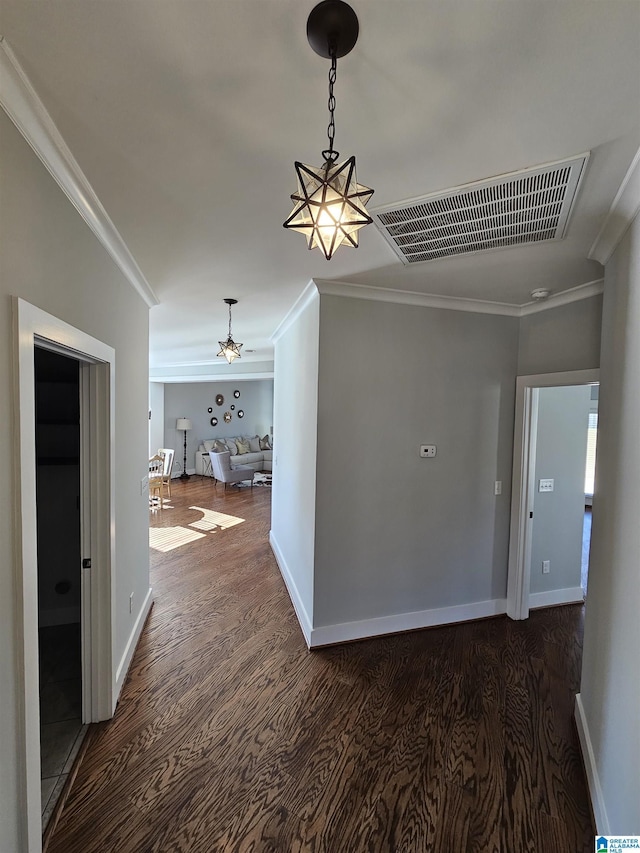 corridor featuring dark hardwood / wood-style floors and ornamental molding