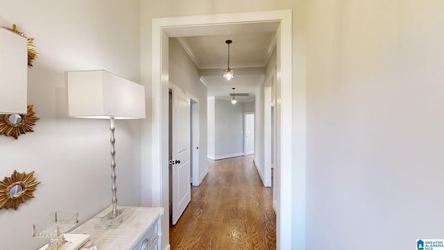 hall featuring dark hardwood / wood-style floors and crown molding