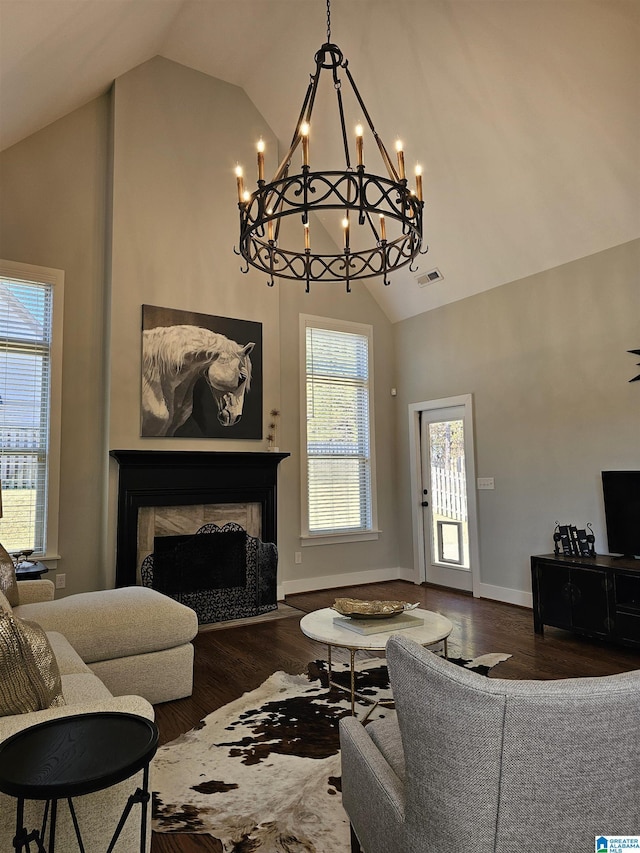 living room with dark hardwood / wood-style flooring and high vaulted ceiling