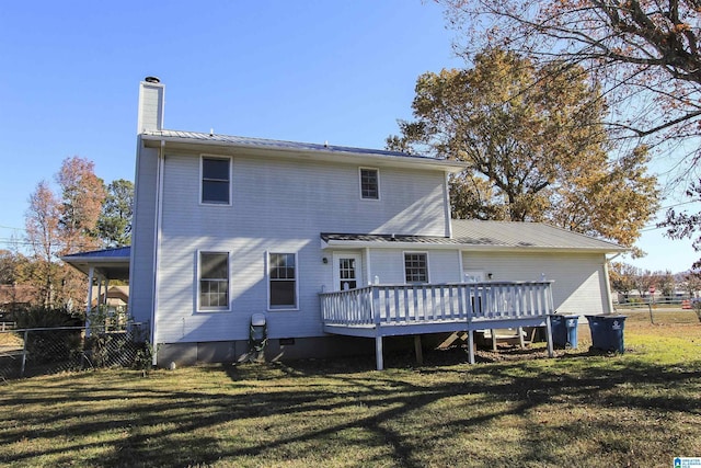 back of house with a lawn and a wooden deck