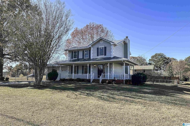 view of front of house with a porch and a front yard