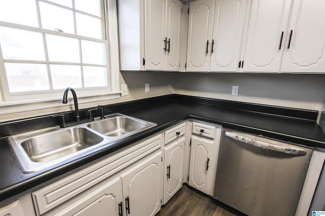 kitchen with white cabinetry, stainless steel dishwasher, dark wood-type flooring, and sink