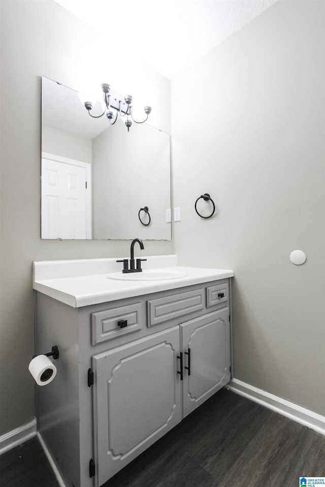 bathroom with vanity and wood-type flooring