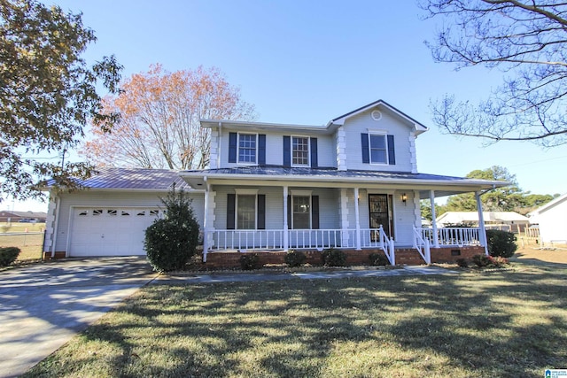 farmhouse with a front lawn and a garage