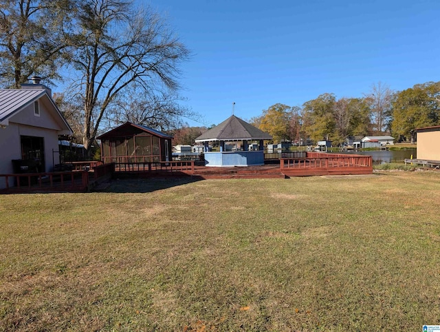 view of yard featuring a gazebo and a deck