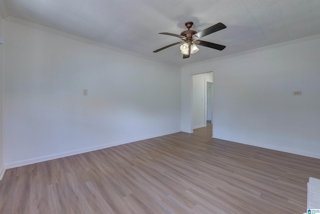 empty room featuring crown molding, ceiling fan, and light hardwood / wood-style floors