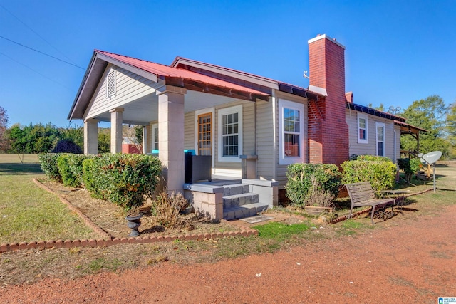 back of house with a porch