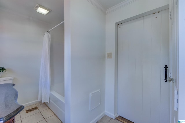 bathroom with tile patterned flooring, shower / bath combo, and crown molding