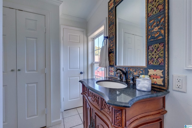 bathroom featuring tile patterned flooring, vanity, and ornamental molding