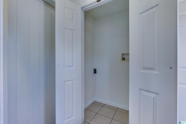 laundry area featuring light tile patterned floors and washer hookup