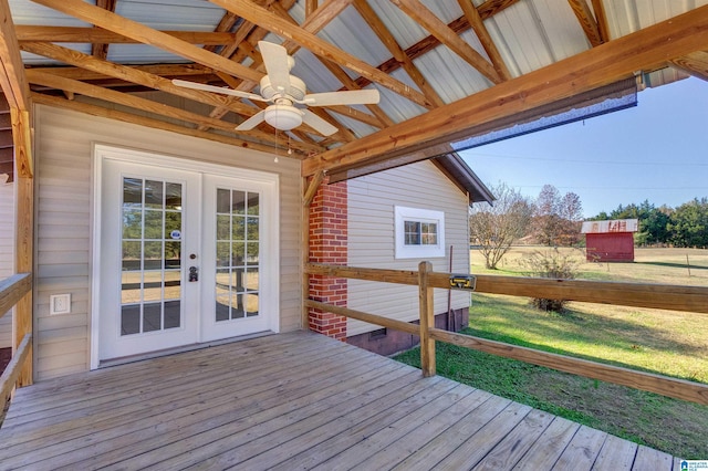 wooden deck with ceiling fan and french doors