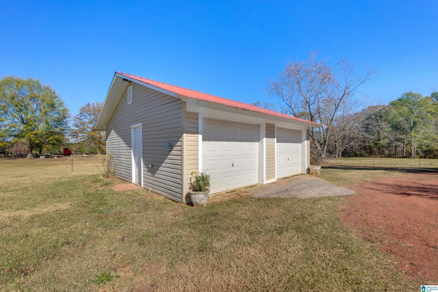 garage with a lawn