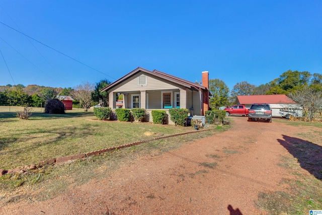 view of front of home featuring a front lawn and covered porch