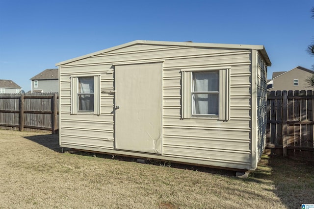 view of outbuilding with a yard