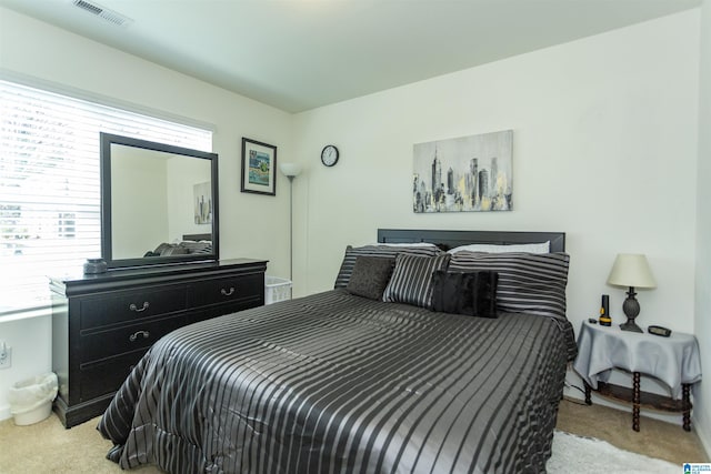 bedroom with light colored carpet