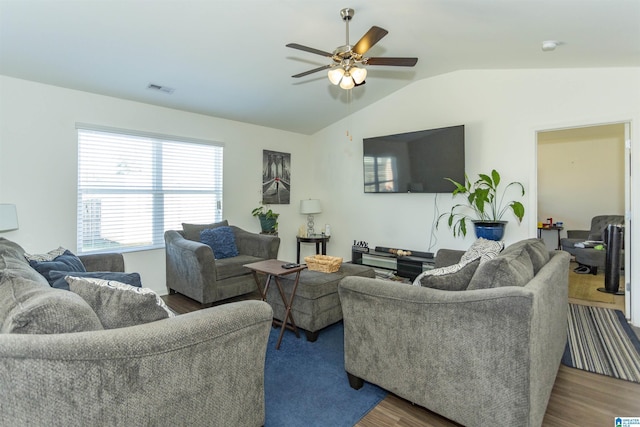 living room featuring hardwood / wood-style flooring, ceiling fan, and lofted ceiling