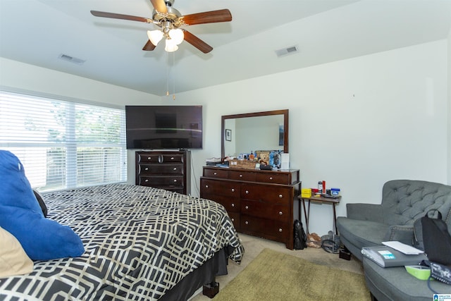 carpeted bedroom with ceiling fan and lofted ceiling