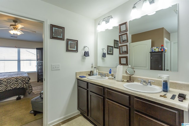 bathroom with ceiling fan and vanity