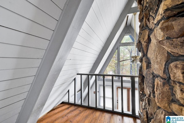 interior space with wood-type flooring and vaulted ceiling