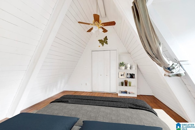 bonus room featuring wood-type flooring, high vaulted ceiling, ceiling fan, and beam ceiling