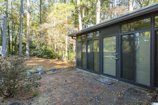 exterior space featuring a sunroom