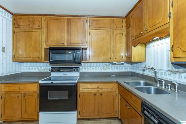 kitchen featuring backsplash, sink, and black appliances