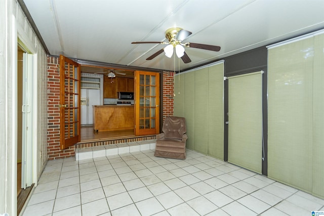 unfurnished living room with ceiling fan