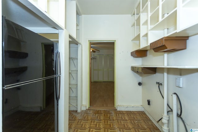 washroom featuring ceiling fan, hookup for a washing machine, and dark parquet floors