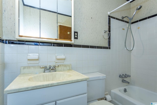 full bathroom with decorative backsplash, vanity, toilet, and tiled shower / bath combo