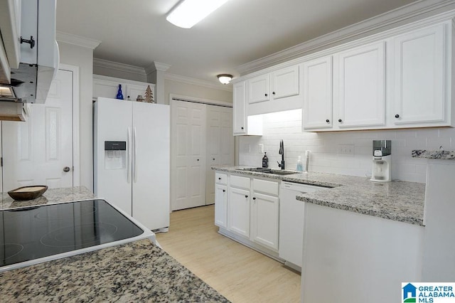 kitchen with light wood-type flooring, white appliances, crown molding, sink, and white cabinetry