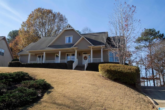 view of front facade with a porch and a front yard