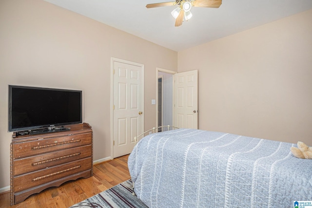 bedroom featuring light wood-type flooring and ceiling fan