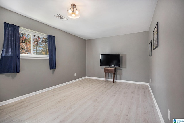 unfurnished living room with light hardwood / wood-style floors