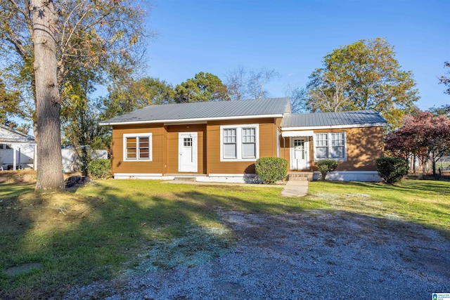 ranch-style home with a front yard