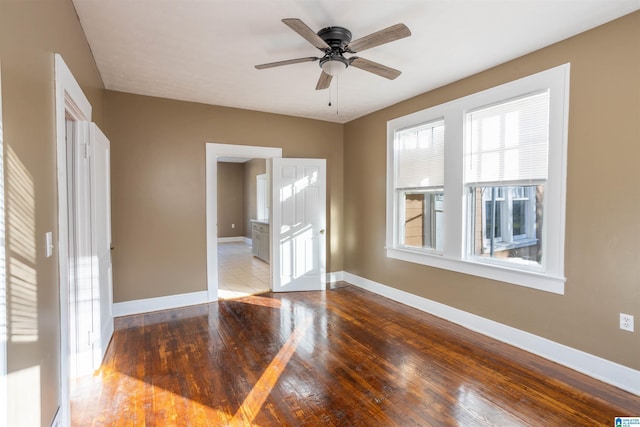 spare room featuring light hardwood / wood-style flooring and ceiling fan