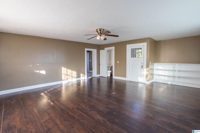 spare room with dark hardwood / wood-style floors and ceiling fan